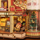 Detail van de fabrieksvloer en kerstboom van de Robotime Dream Gift Factory