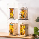 Vier book nooks op elkaar gestapeld in Robotime Dust Covers WD1001