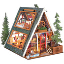 Productfoto van de Robotime A-Frame Cabin, miniatuur vakantiehuisje in winterse, Oostenrijkse stijl