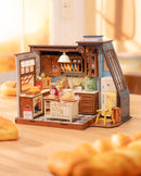 Sfeervolle presentatie van de Robotime Baking Kitchen, omringd met verse broodjes