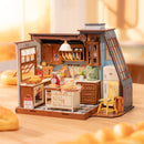 Sfeervolle presentatie van de Robotime Baking Kitchen, miniatuurhuisje van een ouderwets keukentje waar brood en banket wordt gebakken