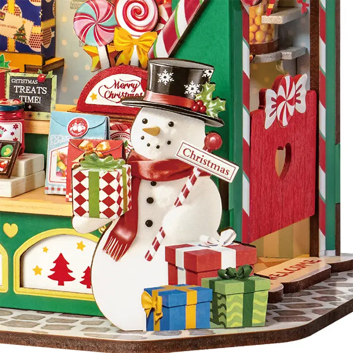 Close-up van de sneeuwpop die voor de Robotime Christmas Candy Stand staat