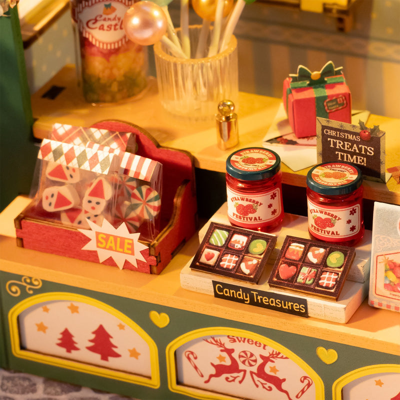 Kerstsnoepgoed en lekkernijen uitgestald op de toonbank van de Robotime Christmas Candy Stand