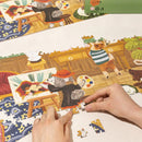 Een persoon is bezig met de Robotime Doggie Art Gallery te maken