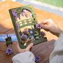 Een persoon die de Robotime Glittering Water Lily aan het bouwen is