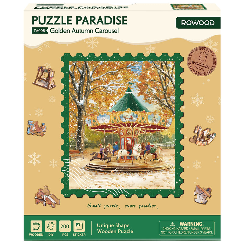 Voorkant verpakking van de Robotime Golden Autumn Carousel, legpuzzel met bijzondere stukjes, met daarop afgebeeld een ouderwetse carousel op een sneeuwachtige herfstdag