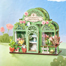 Sfeervolle presentatie van de Robotime Green Fountain Garden, bouwpakket voor een miniatuurhuisje van een bloemenwinkel in een sierlijke tuinkas