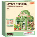 Voorkant verpakking van de Robotime Green Fountain Garden, bouwpakket voor een miniatuurhuisje van een bloemenwinkel in een sierlijke tuinkas