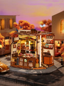 Sfeervolle presentatie van de Robotime Henry’s Chocolate, miniatuurhuisje van een ouderwets chocoladewinkeltje