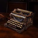 Sfeervolle presentatie van de Robotime Mechanical Typewriter (Classic Version), houten bouwpakket van zwart- en goudkleurige, functionerende typemachine