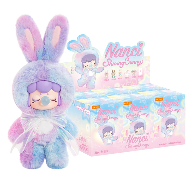 De blauw-paarse variant en omdoos met zes blind boxes van de Robotime Nanci Shining Bunny, blind box van een schattig figuurtje in konijnenpak in verschillende kleuren