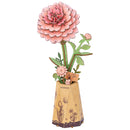Productfoto van de Robotime Pink Dahlia, houten bouwpakket van een roze dahlia in een kartonnen vaasje