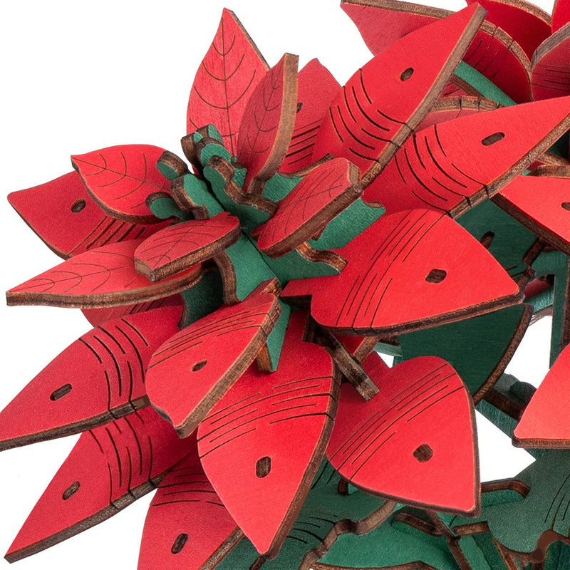 Close-up van een van de bloemen van de Robotime Poinsettia