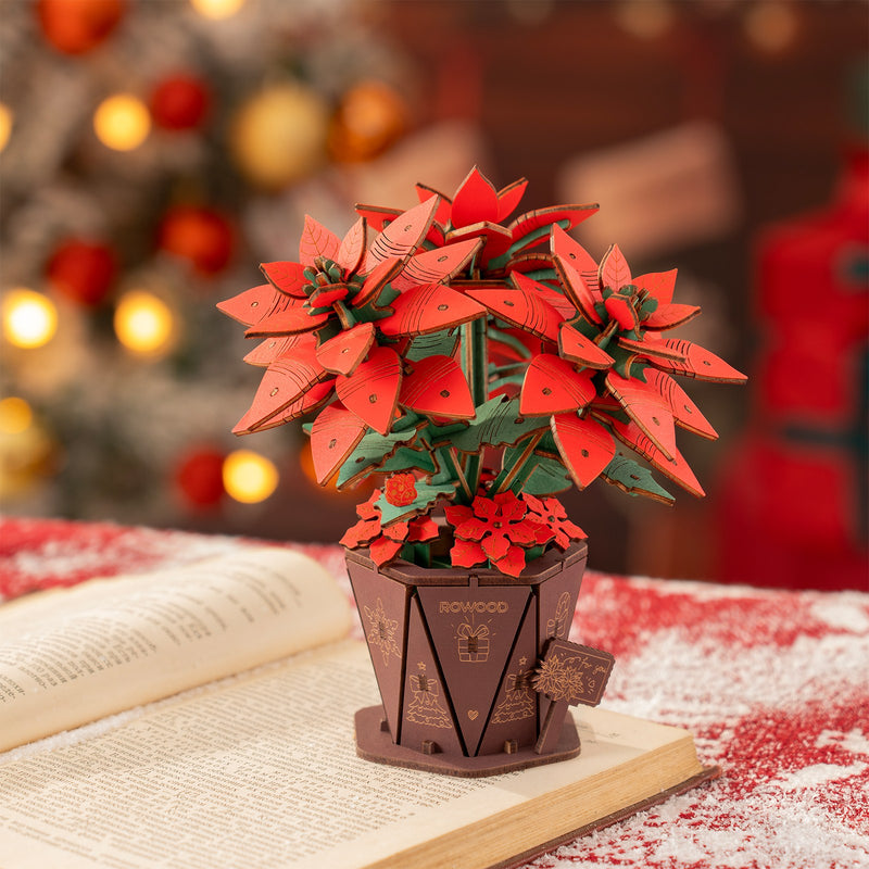 Sfeervolle presentatie van de Robotime Poinsettia, houten bouwpakket van een kerstbloem