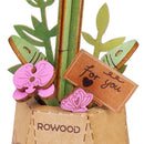 Close-up van de decoratie in het vaasje van de Robotime Purple Moth Orchid