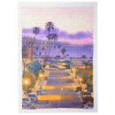 Productfoto van de Robotime Purple Sunset Walk, 1.000 stukjes legpuzzel van een straat in een rustig stadje tijdens een paarsgekleurde zonsondergang