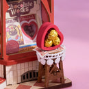 Bonbons in een hartvormig doosje in de Robotime Sweet Chocolate Shop