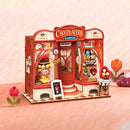 Sfeervolle presentatie van de Robotime Sweet Chocolate Shop, bouwpakket voor een miniatuurhuisje van een ouderwetse chocoladewinkel