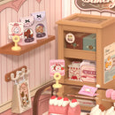 Details van de toonbank, een schapje en een kastje van de Robotime Tasty Cake Shop