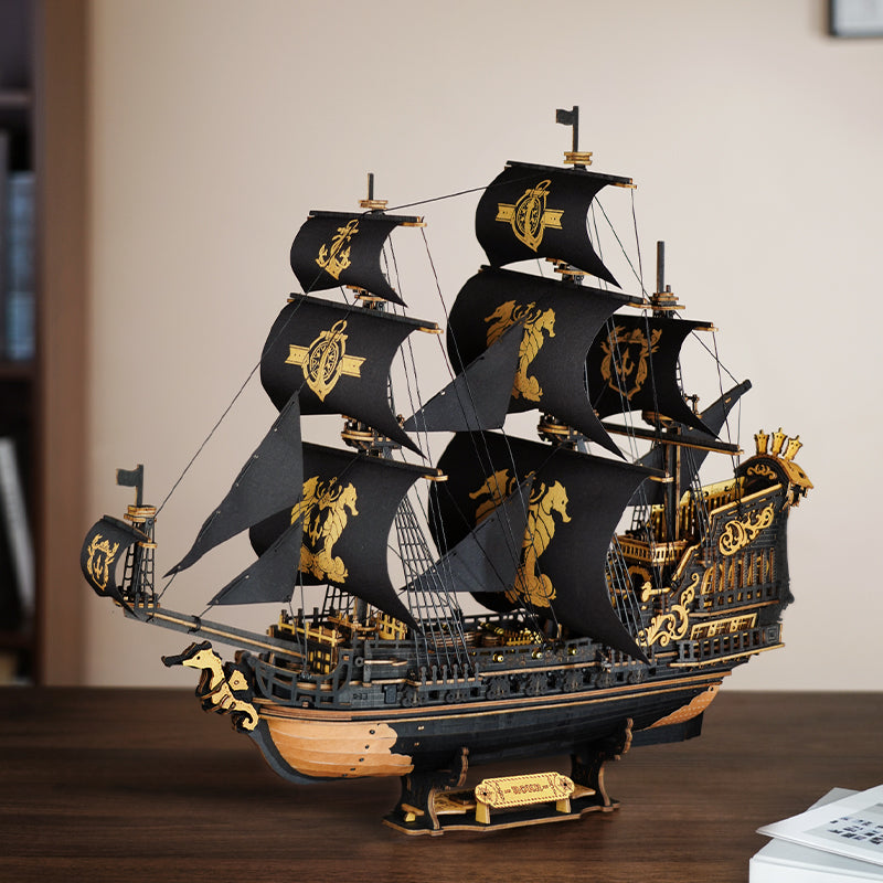 Sfeervolle presentatie van de Robotime Seahorse Barque, zwart houten zeilschip met gouden details