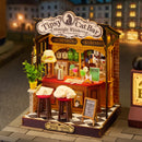 Sfeervolle presentatie van de Robotime Tipsy Cat Bar, miniatuurhuisje van een bar waar een kat op de barkruk slaapt
