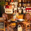 Close-up van een tafeltje met stoeltjes en de bar op de achtergrond van de Robotime Tipsy Restaurant